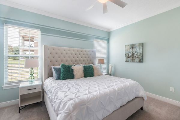 The downstairs Master Suite features a comfortable King sized bed and luxurious details