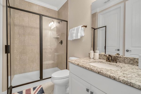 The ensuite bathroom has a walk in shower and plenty of room to get ready