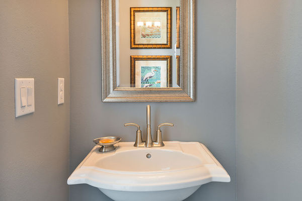 A half bathroom located by the covered lanai