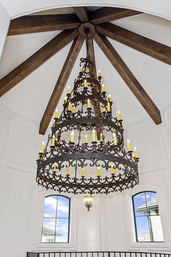 The custom Renaissance-inspired chandelier hangs beautifully from the 35-foot high celling