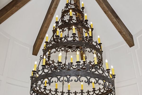The custom Renaissance-inspired chandelier hangs beautifully from the 35-foot high celling