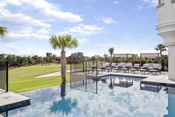Spend your days lounging by this incredible custom built pool with an unbeatable view