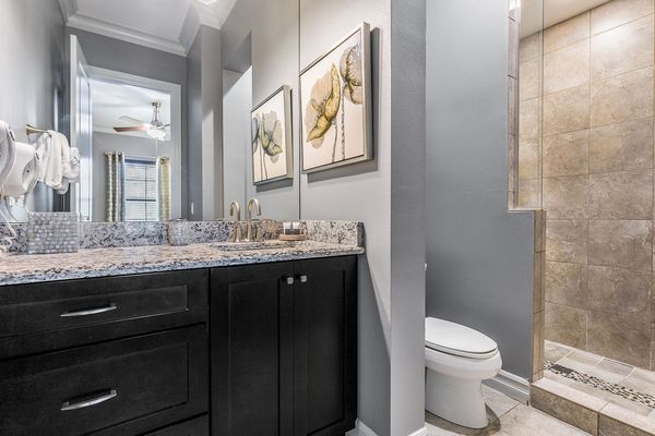 En-suite bathroom with glass door walk-in shower