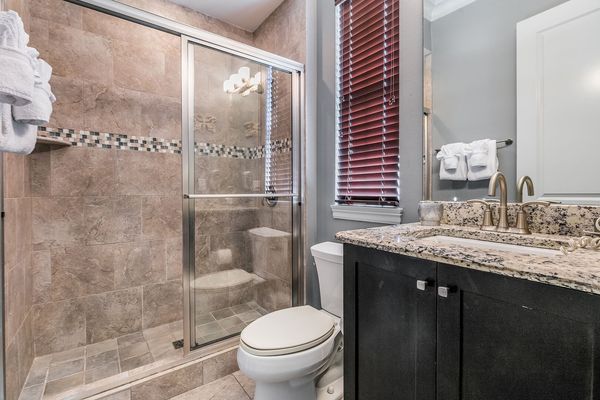 En-suite bathroom with glass door walk-in shower
