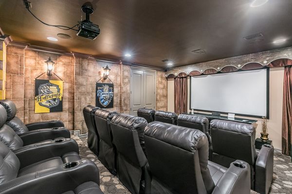 Host a movie night in the homes private theater room with a 120-inch projection screen