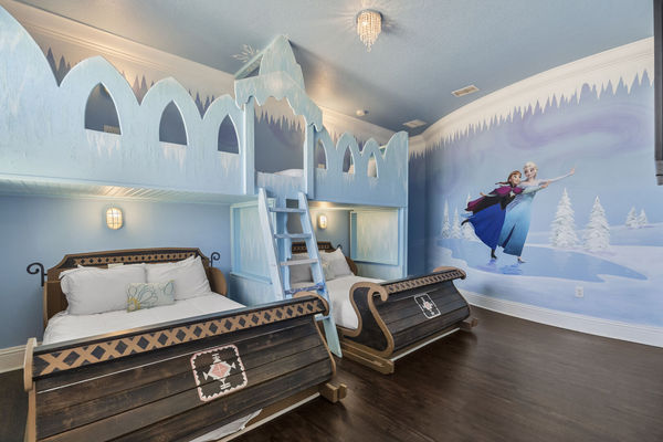 Head upstairs to this icy princess room complete with two full beds and two twin beds