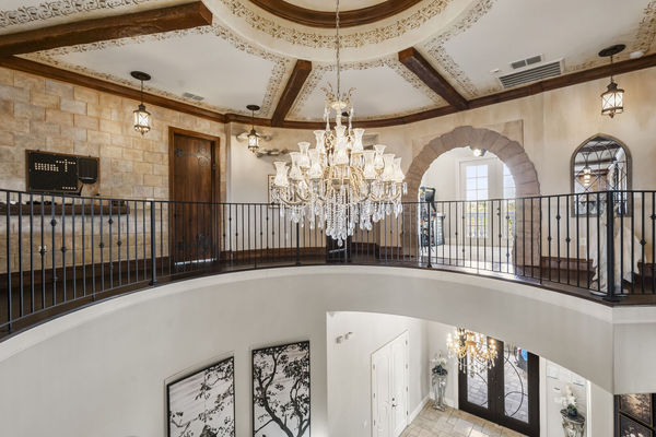 The upstairs loft area overlooks the foyer and also has access to a beautiful balcony