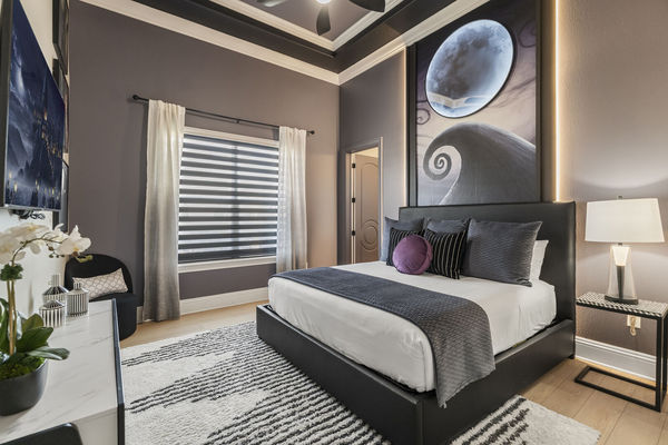 Relax and fall asleep to a favorite show in this cozy bedroom