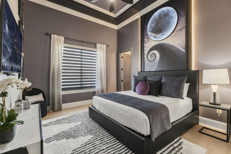 Relax and fall asleep to a favorite show in this cozy bedroom