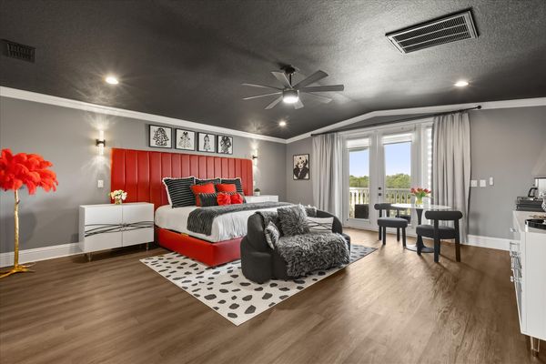This luxurious master bedroom features a King bed and a private balcony