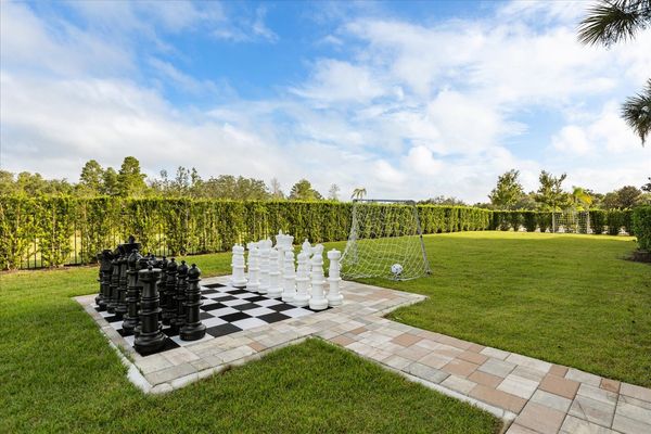 The home features a beautiful green space to play games outdoors