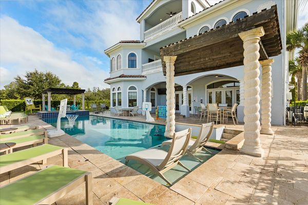 This luxurious 12-bedroom villa features incredible amenities for your next Orlando vacation