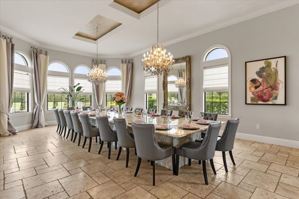Dine in style at the formal dining table, which comfortably seats 20 guests for any occasion
