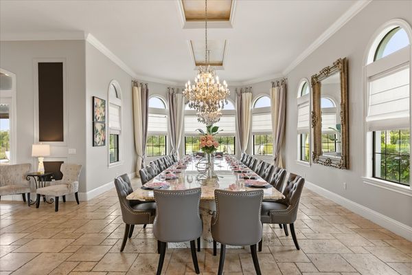 This luxurious formal dining table seats 20 guests to enjoy meals together