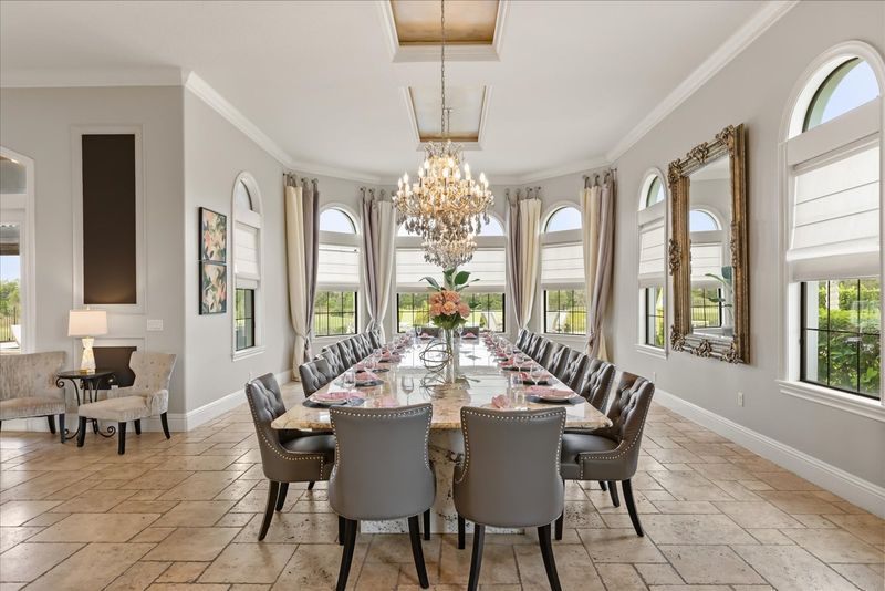 This luxurious formal dining table seats 20 guests to enjoy meals together