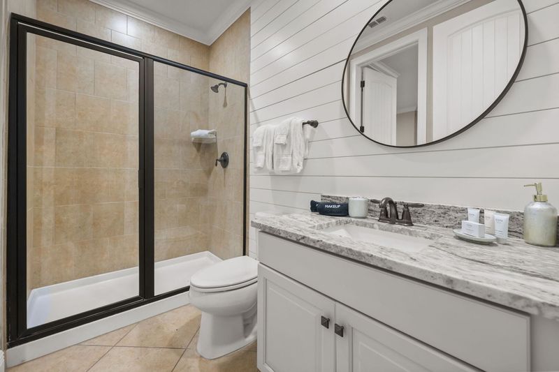 The ensuite bathroom has a walk in shower and plenty of room to get ready.