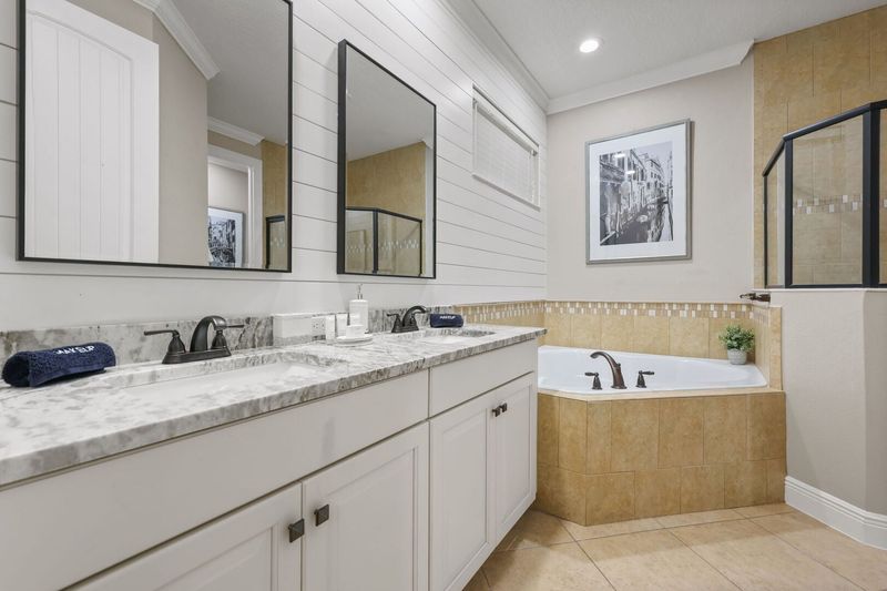 The beautiful ensuite master bathroom with Italian decor.