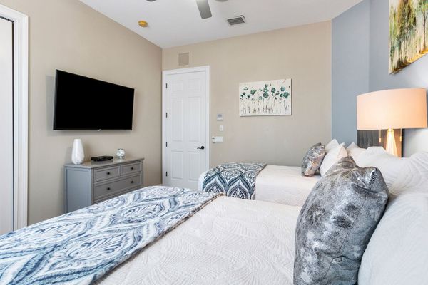 Watch your favorite show before bed in this comfortable bedroom