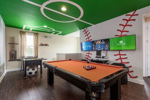 3 43-inch SMART TVs are on the wall connected to a PS4 and Xbox One S