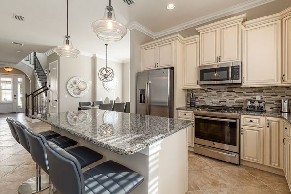 Enjoy the fully-equipped kitchen, complete with stainless steel appliances and granite countertops