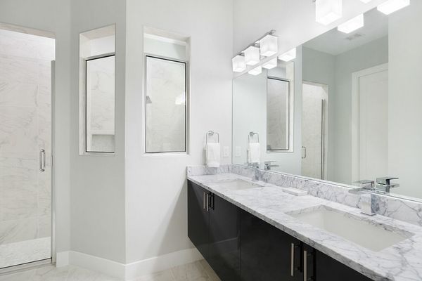 Beautiful bathroom countertops with a dual vanity and walk in shower