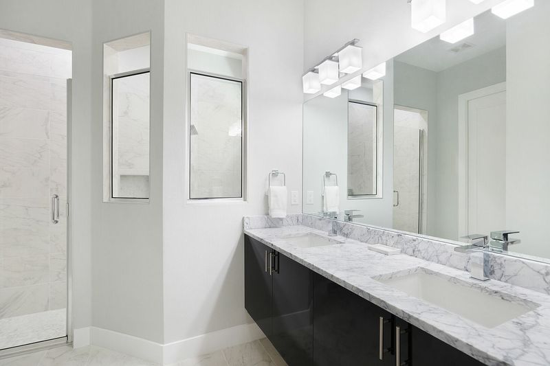 Beautiful bathroom countertops with a dual vanity and walk in shower