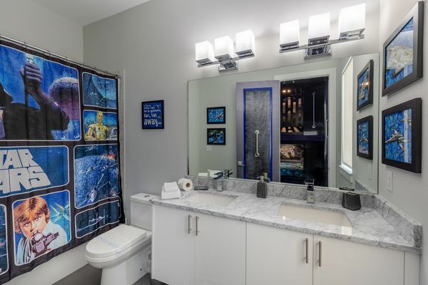 Custom themed bathroom to match with a dual vanity