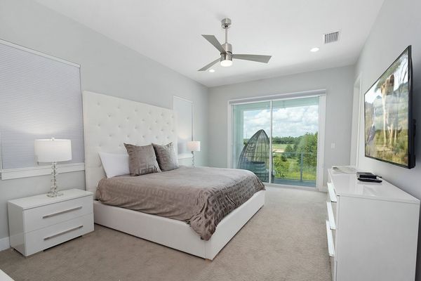 A beautiful master suite that has access to the second floor balcony