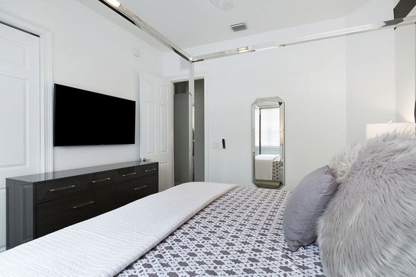 SMART TV and dresser inside large closet