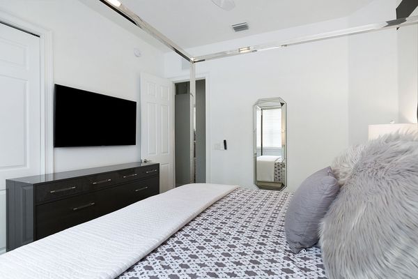 SMART TV and dresser inside large closet