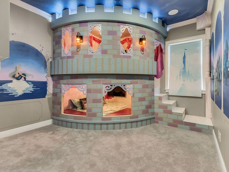 A magical castle awaits princesses in this amazing custom built full over full bed
