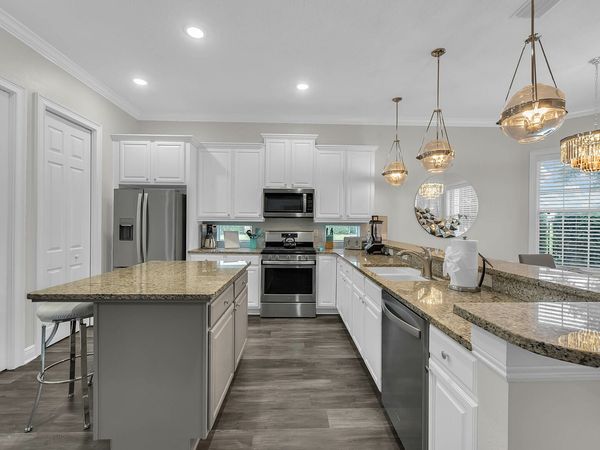 Large fully equipped kitchen with stainless steel appliances