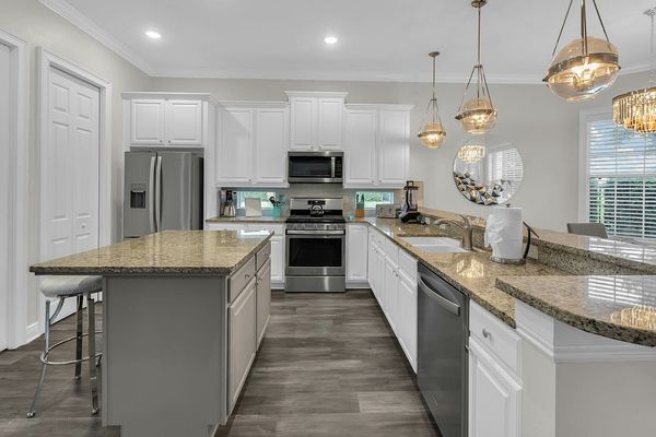 Large fully equipped kitchen with stainless steel appliances