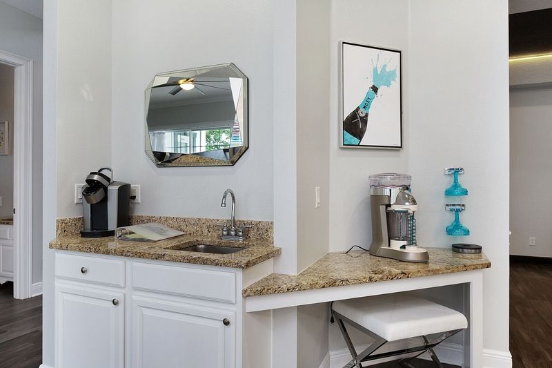 Enjoy the wet bar that features a margarita mixer and kuerig