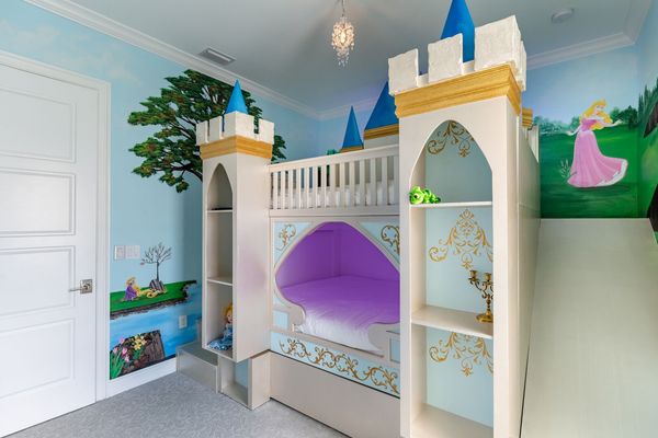 A custom-built castle bunkbed awaits them with cubby storage