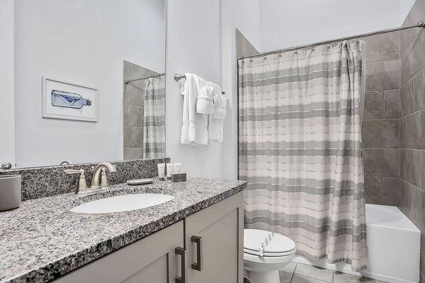 En suite bathroom with combined tub and shower