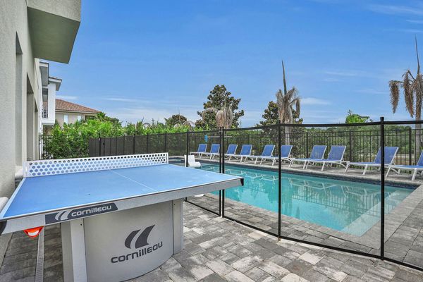 Play ping pong while your family swims beside you