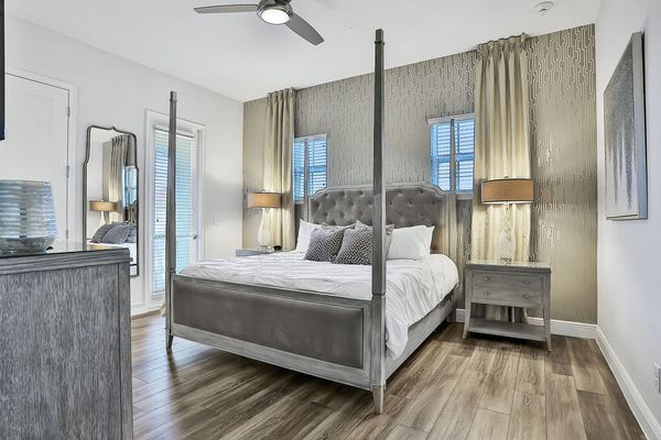 This master suite has a king bed and private access to the second-floor balcony
