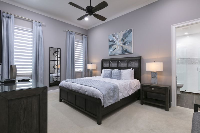 Stretch out on this king-sized bed after a day of exploring Orlando attractions