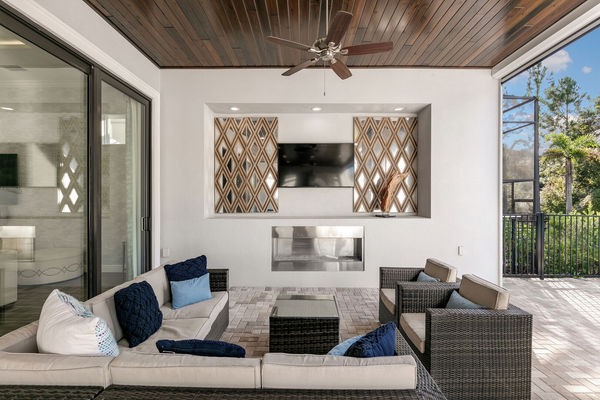 The pool patio has everything you could think of (Disclaimer: Fireplace(s) not allowed for guest use, homeowner use only.)