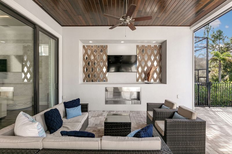 The pool patio has everything you could think of (Disclaimer: Fireplace(s) not allowed for guest use, homeowner use only.)