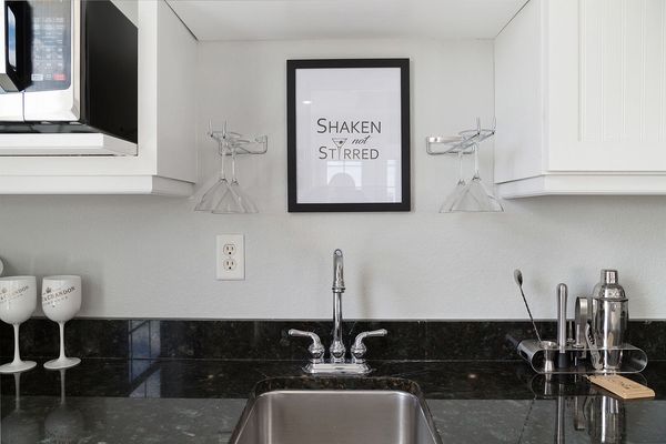 Wet bar with fridge for cocktails and also a microwave perfect for making popcorn