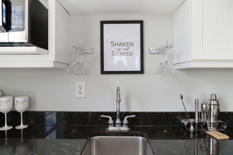 Wet bar with fridge for cocktails and also a microwave perfect for making popcorn