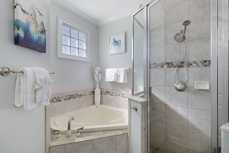 The ensuite bathroom has a beautiful garden tub and walk in shower
