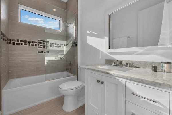 Hallway bathroom with a combination show/tub