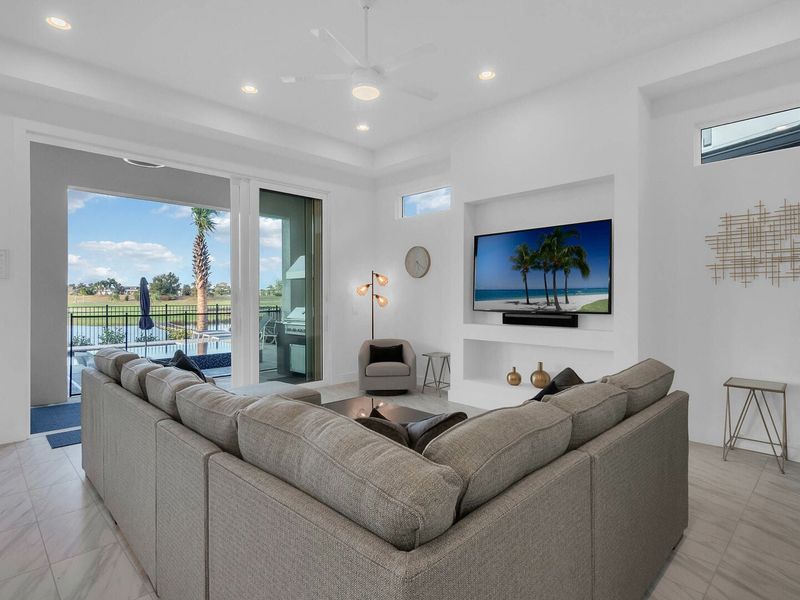 Watch TV on the 75-inch Smart TV