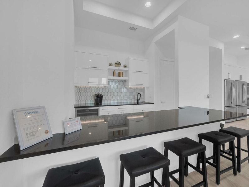 Show off your bartending skills to family and friends at the custom built bar