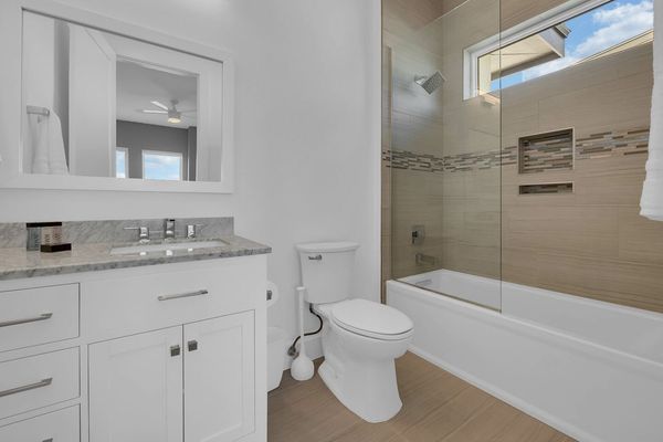 This bathroom has a combination shower and tub