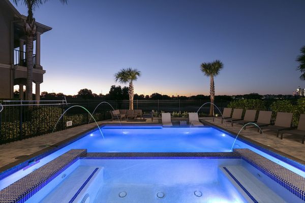Exterior lighting illuminates the pool for the perfect twilight experience
