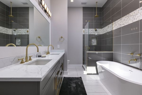 Ensuite bathroom with dual sink vanity, garden tub and walk-in shower